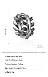 Detailed view of silver titanium steel leaf-shaped hoop earrings with 11mm dimensions