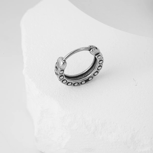 Vintage punk silver hoop earring with embossed dot pattern and oxidized texture