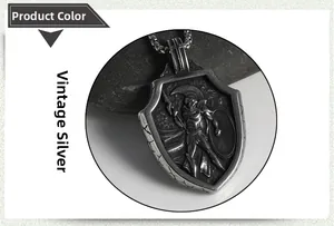 Detailed close-up of retro silver Spartan warrior shield pendant on black pebbles