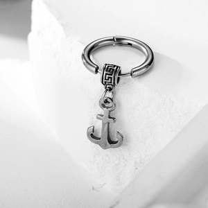 Vintage stainless steel hoop earring with anchor pendant on white stone base