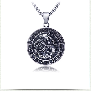 Detail of Viking dragon pendant with Celtic knot and Nordic runes on box chain