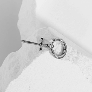 Punk style stainless steel hoop earring featuring a sword pendant with black stone inlay