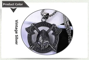 Close-up of vintage silver Viking necklace with warrior helmet, axes and runes