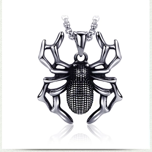 Macro shot of a gothic titanium steel spider pendant with a detailed textured abdomen
