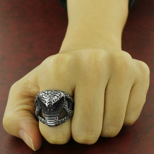 Vintage stainless steel cobra snake ring with detailed scales and rugged silver finish