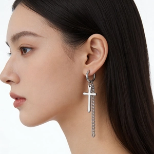 Silver stainless steel hoop earring with hanging cross and long chain on model ear