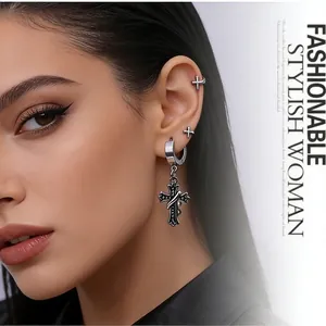 Three-piece punk stainless steel cross earrings set worn by model for Halloween style