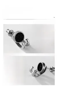 Macro detail showing mirror polished titanium steel stud with black textured inlay