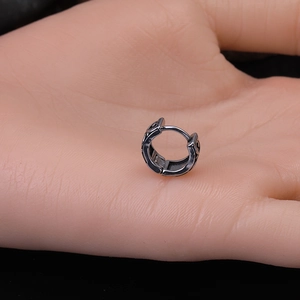 Men's retro dragon totem earrings in grey cast steel shown on hand for scale