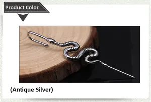 Detailed macro view of antique silver snake ear cuff with realistic scales and textures