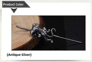 Detailed view of antique silver tiger hair pin with vintage metallic texture