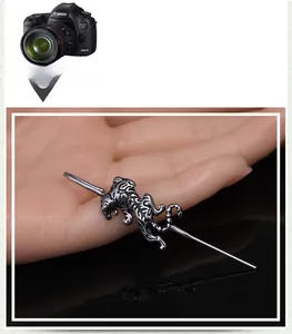 Detailed view of a stainless steel industrial barbell featuring a 3D tiger sculpture