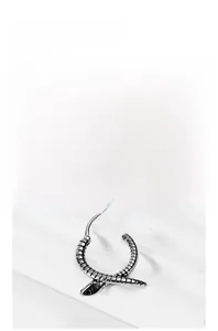 Macro shot of titanium steel snake hoop earring showing intricate vintage textures