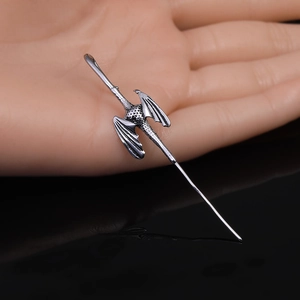 Vintage silver dragon hair pin with intricate wings and punk style aesthetic