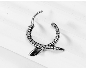 Detailed macro view of snake-shaped titanium steel earring with intricate scale texture