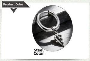 Macro shot of steel color stainless steel earring with textured arrowhead charm on dark stone