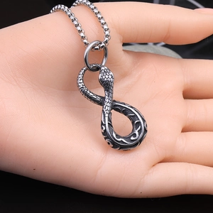 Vintage silver snake pendant necklace with infinity design on a bead chain strand