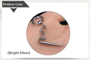 Close-up of shiny silver punk hoop earring with chain and conical metal pendant