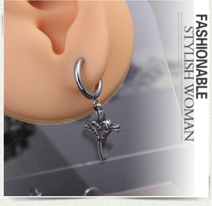 Detail shot of a silver steel hoop earring with a 3D cross pendant on an ear model