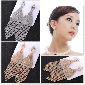 Sparkling rhinestone tassel earrings in gold and silver finish with diamond accents