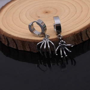 Retro punk skeleton hand drop earrings in vintage silver stainless steel on wooden stand