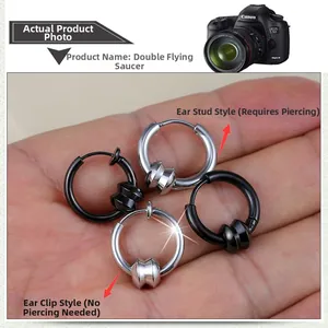 Detail showing black and silver stainless steel hoop earrings with unique UFO metal rings
