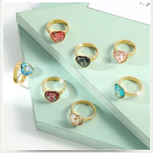 Set of seven gold plated titanium steel heart rings with colorful cat eye stones