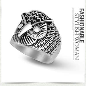 Detailed side view of vintage owl ring in stainless steel with intricate feather texture