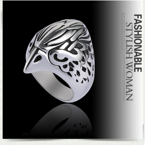 Detailed close-up of eagle head ring with vintage silver finish and relief carving