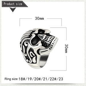 Macro detail of retro skull ring showing embossed flame patterns and 30mm size markings