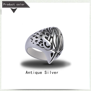 Detail of antique silver eagle head ring with intricate hollow side patterns for men