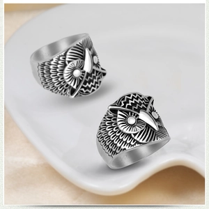Macro shot of owl head ring detail with textured feathers and S-STEEL inner band