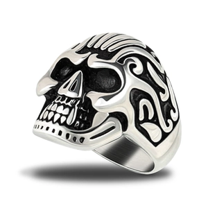 Detailed close-up of retro gothic skull ring in oxidized stainless steel with flame motif