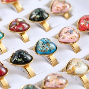 Golden titanium steel heart rings with colorful opal stones in a 36-piece display box
