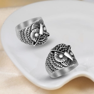Vintage stainless steel owl rings with detailed feather texture and retro oxidized finish