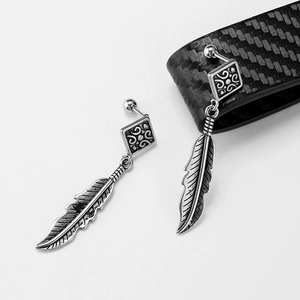Vintage stainless steel square stud earrings with textured feather charms on gray background
