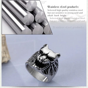 Vintage stainless steel ring for men featuring detailed wolf head carving and cross design