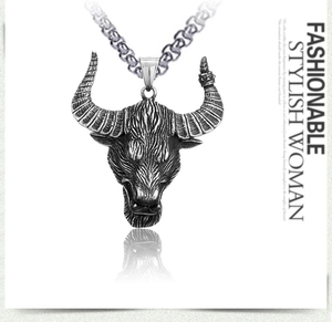 Macro shot of retro stainless steel bull head pendant with brushed texture and metal chain