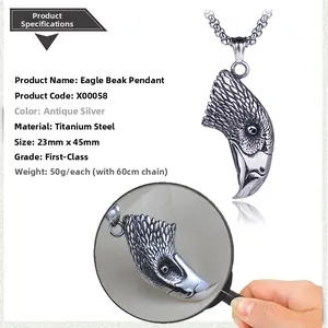 Macro shot of antique silver eagle head pendant in titanium steel with detailed texture