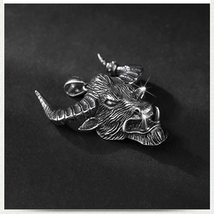 Vintage bull head pendant in oxidized stainless steel with intricate spiral horn details