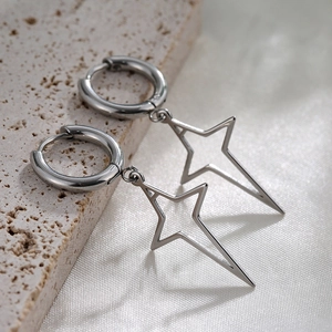 Silver S925 sterling silver hoop earrings with hollow star charms on satin background
