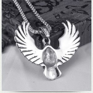Detail of retro stainless steel eagle pendant with S-STEEL engraving and bead chain