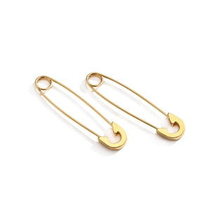 Polished gold stainless steel safety pin earrings in a minimalist punk rock style