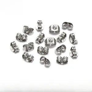 Macro shot of silver-tone butterfly clutch earring backs for DIY jewelry making
