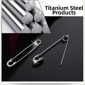 Macro shot of silver titanium steel safety pin earrings in open and closed positions