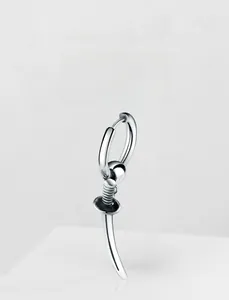 Macro shot of silver hip-hop earrings featuring a hoop with a sleek sword-shaped pendant