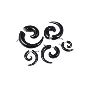 Black spiral acrylic taper earrings set with five different sizes on white background