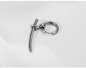 Detailed view of silver katana sword pendant on a punk style stainless steel hoop earring