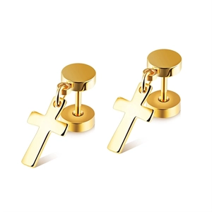 Macro shot of gold cross pendant earrings with smooth polished stainless steel finish