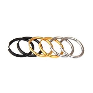 Classic stainless steel hoop earrings set in black, gold, and silver finishes for men